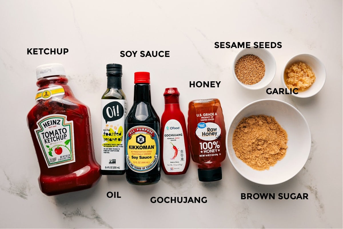 Ingredients In Korean Chicken Sauce All the sauce ingredients prepped and ready, including ketchup, oil, soy sauce, gochujang, honey, sesame seeds, garlic, and brown sugar.