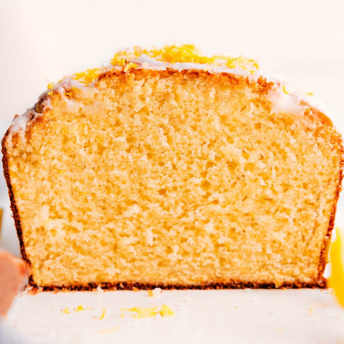 Flavor-Packed And Delicious Lemon Bread Recipe Lemon bread recipe freshly cut open, showing the soft texture inside.