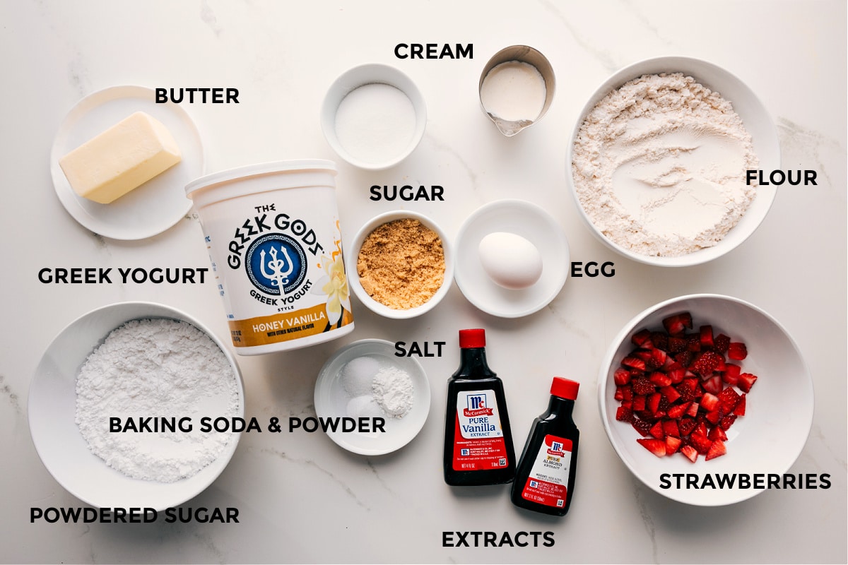Ingredients In Strawberry Scones Recipe All the ingredients in this recipe prepped out for easy assembly including the butter, yogurt, powdered sugar, baking agents, sugar, cream, egg, flour, extracts, and strawberries.