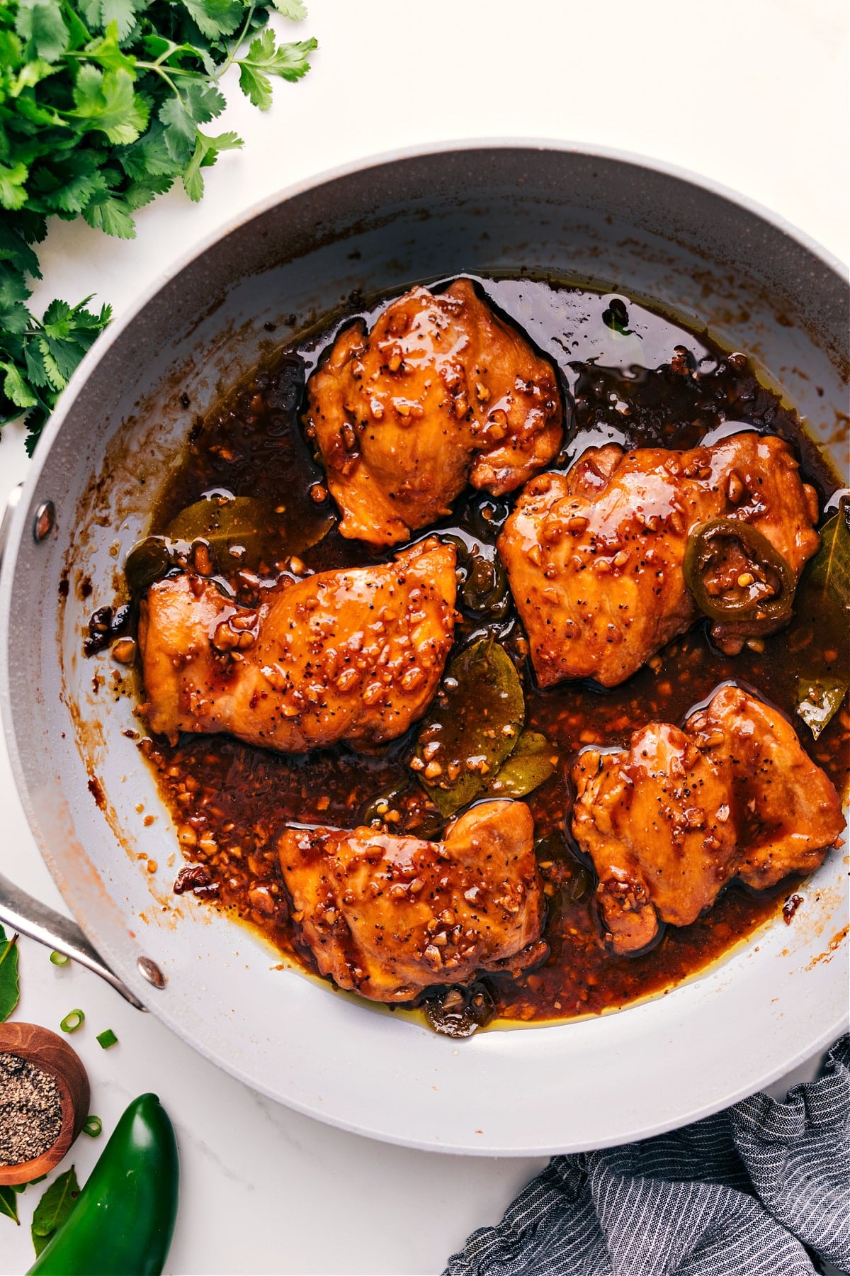Chicken Adobo Recipe simmered in a pot and coated in a rich, glossy sauce.