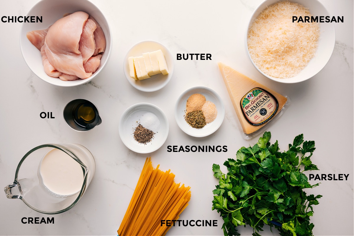 This rich, indulgent, and creamy Chicken Alfredo Recipe brings restaurant-quality to your table, but couldn't be easier to make! It's robustly flavored with minimal ingredients and can be ready in about 30 minutes or less! Recipe via ChelseasMessyApron.com #alfredo #chicken #chickenalfredo #fettuccini #creamy #quick #decadent