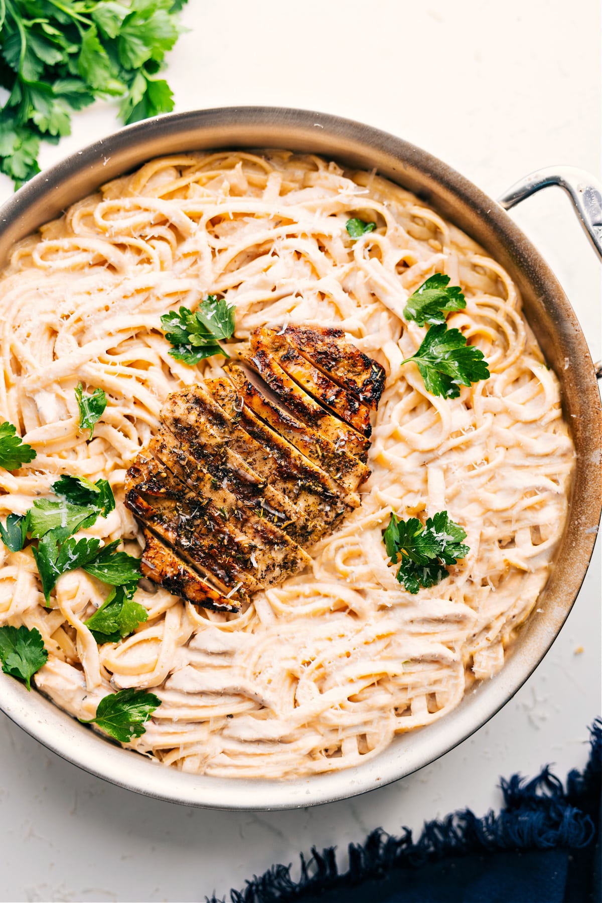 Chicken Alfredo Recipe with the cooked chicken right on top ready to be enjoyed!