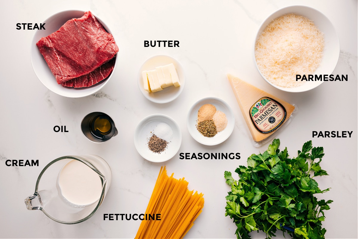 Ingredients In Steak Alfredo Recipe All the ingredients in this recipe prepped out for easy assembly including the steak, butter, oil, cream, seasonings, fettuccine, parsley, and parmesan.