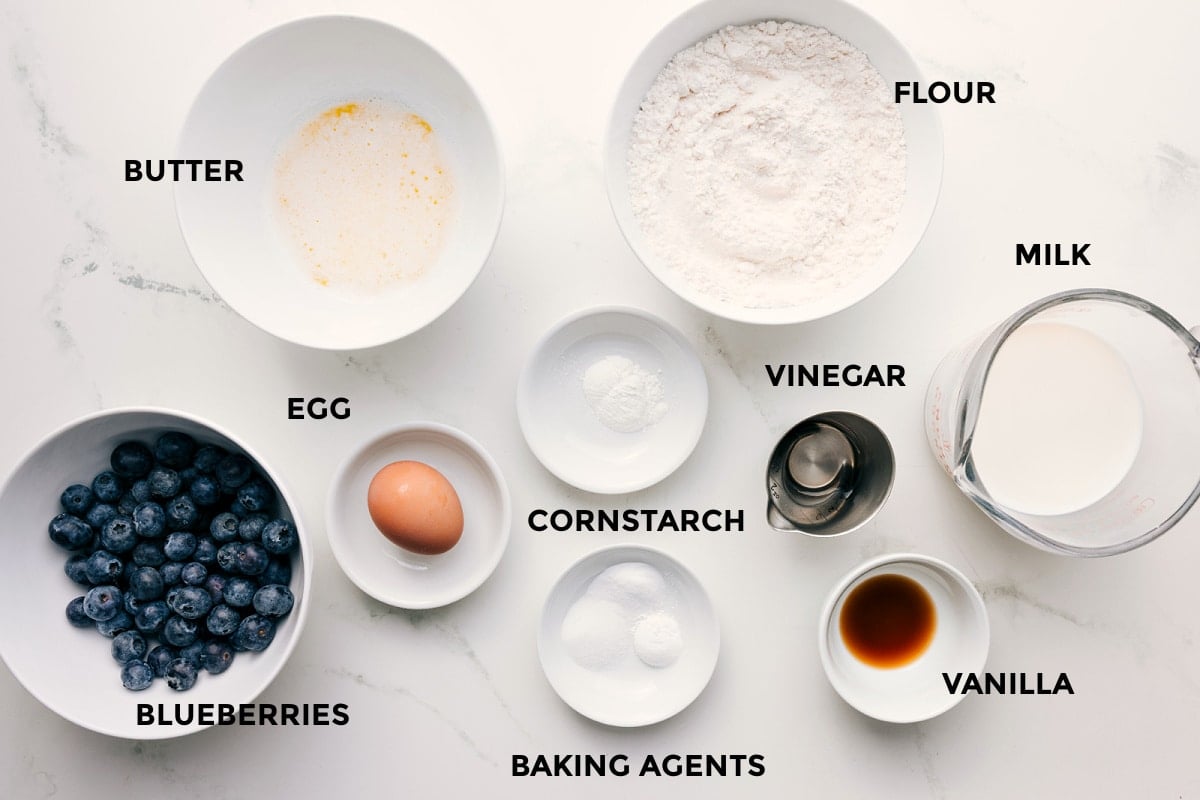 Ingredients In Blueberry Pancake Recipe All the ingredients in this recipe prepped out for easy assembly including the blueberries, butter, egg, baking agents, cornstarch, flour, milk, vanilla, and a vinegar.