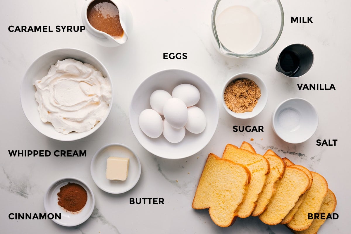 Ingredients In French Toast Recipe All the ingredients in this recipe prepped out for easy assembly including the whipped cream, cinnamon, butter, bread, eggs, sugar, salt, vanilla, milk, and syrup.