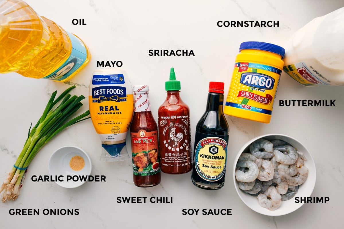 Ingredients In This Bang Bang Shrimp All the ingredients in this recipe prepped out for easy assembly including the oil, garlic powder, green onions, mayo, sweet chili, sriracha, soy sauce, cornstarch, buttermilk, and shrimp.