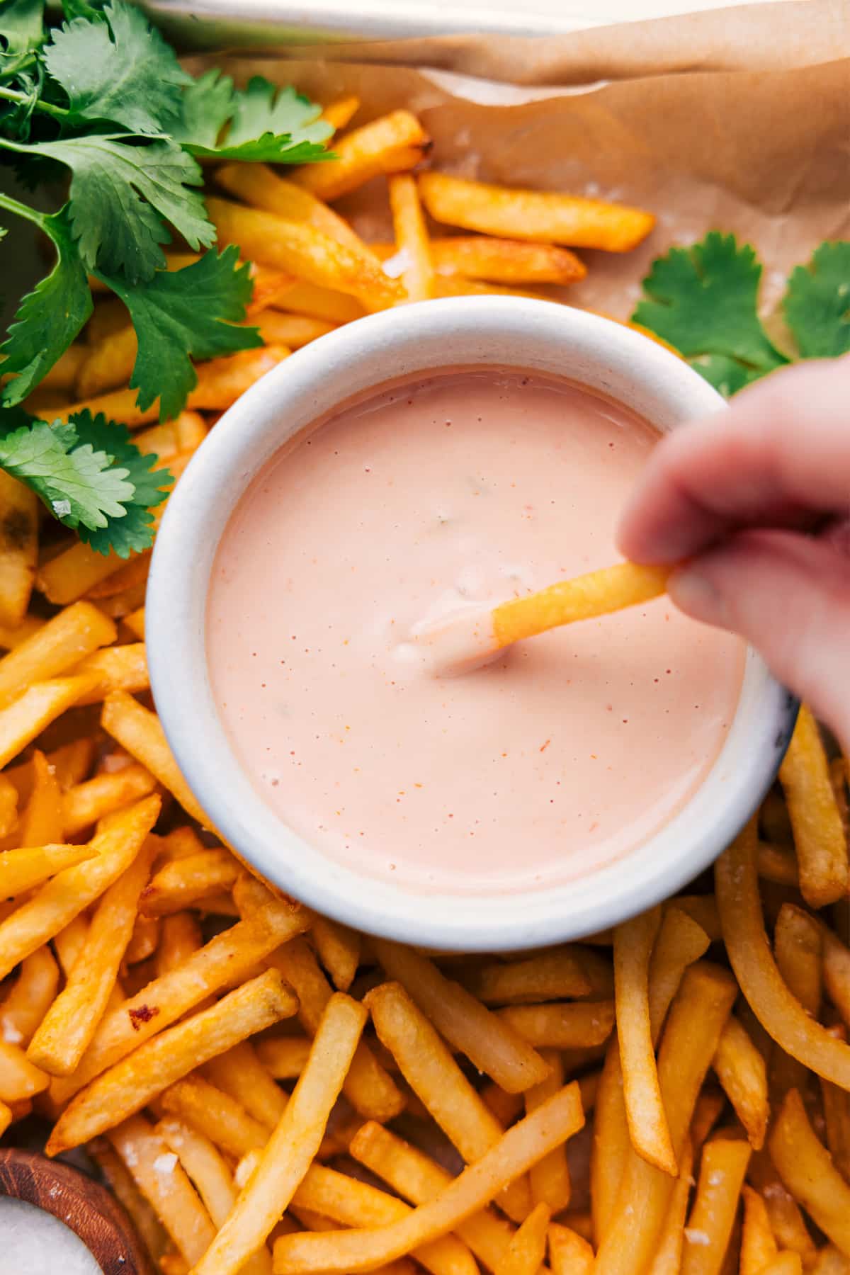 In-N-Out Sauce Recipe with a fry dipping in.