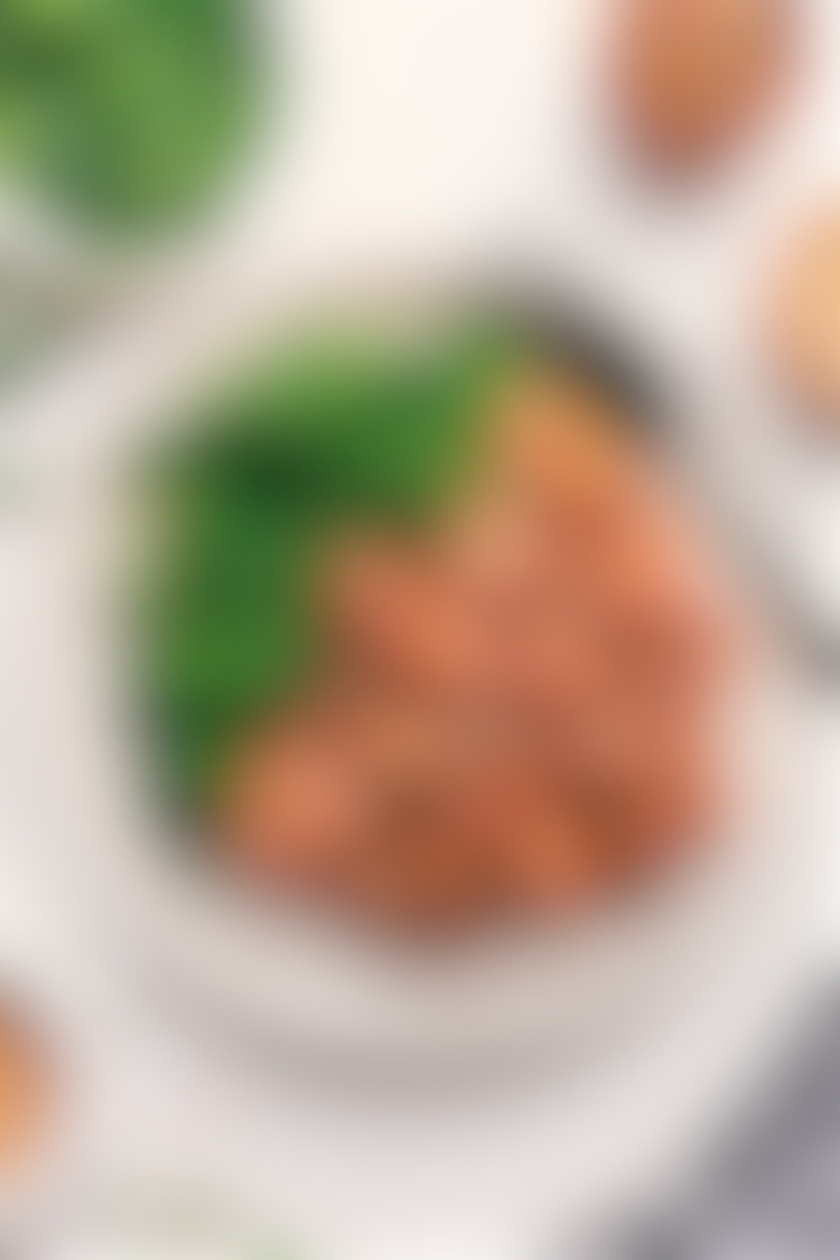 Panda Express orange chicken on a bed of rice with broccoli on the side.