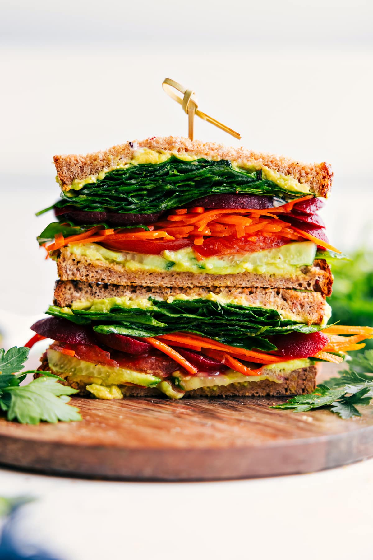 Veggie Sandwich cut in half and showing all the layers of this delicious sandwich.