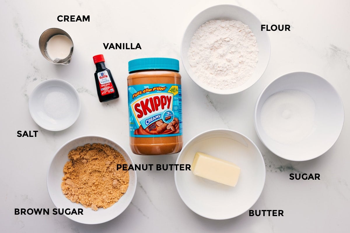 Ingredients In Peanut Butter Edible Cookie Dough All the ingredients in this recipe prepped out for easy assembly including the cream, vanilla, salt, brown sugar, peanut butter, flour, sugar, and butter.